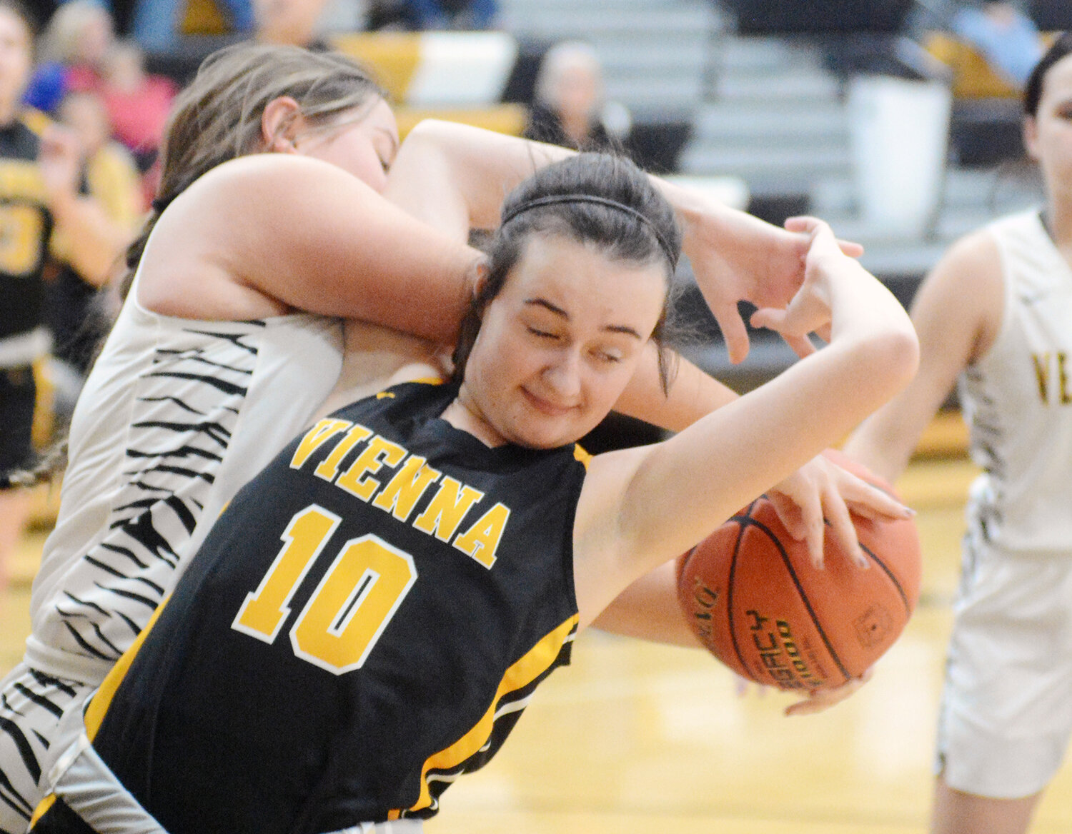 Reese Snodgrass (center) has the basketball taken from her Monday night during road basketball action in Morgan County between Vienna’s Lady Eagles and Versailles Lady Tigers. KC Curler’s Lady Eagles enter 2024 winners of their last three. games.